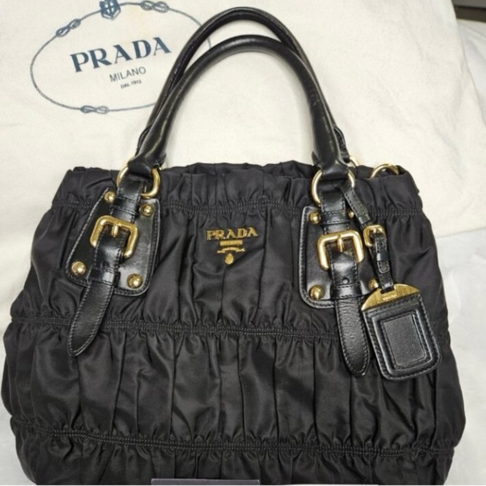 Prada Black Shoulder Bag with Gold Accents .New condition.